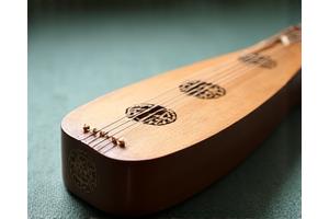 A geomungo, a traditional Korean plucked zither, known for its deep, resonant sound.